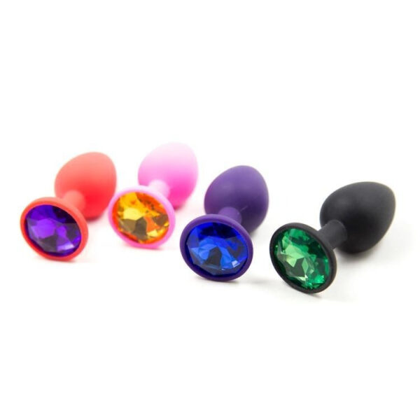 Colorful silicone butt plugs with gem accents, perfect for playful adventures and personal style.