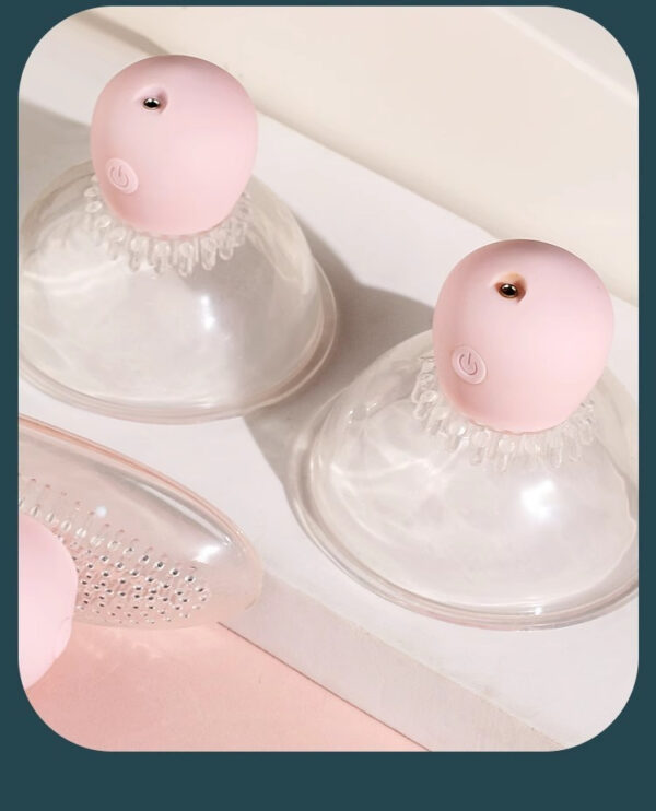 Pastel pink suction cups and massage tool for innovative skincare and wellness solutions.