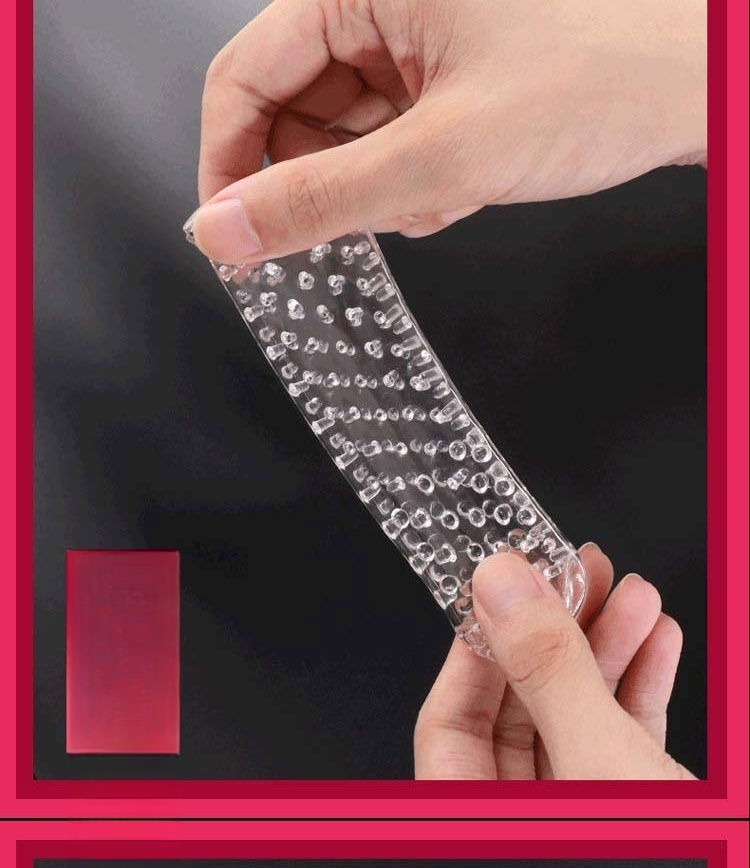 Person holding a flexible sensory strip with texture on a vibrant red background.