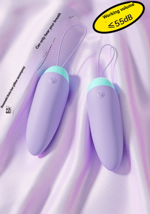 Lavender personal devices with mint accents for discreet, intimate pleasure on luxurious fabric.