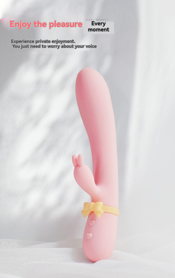 Charming pink rabbit toy with buttons for playful intimacy and modern design.