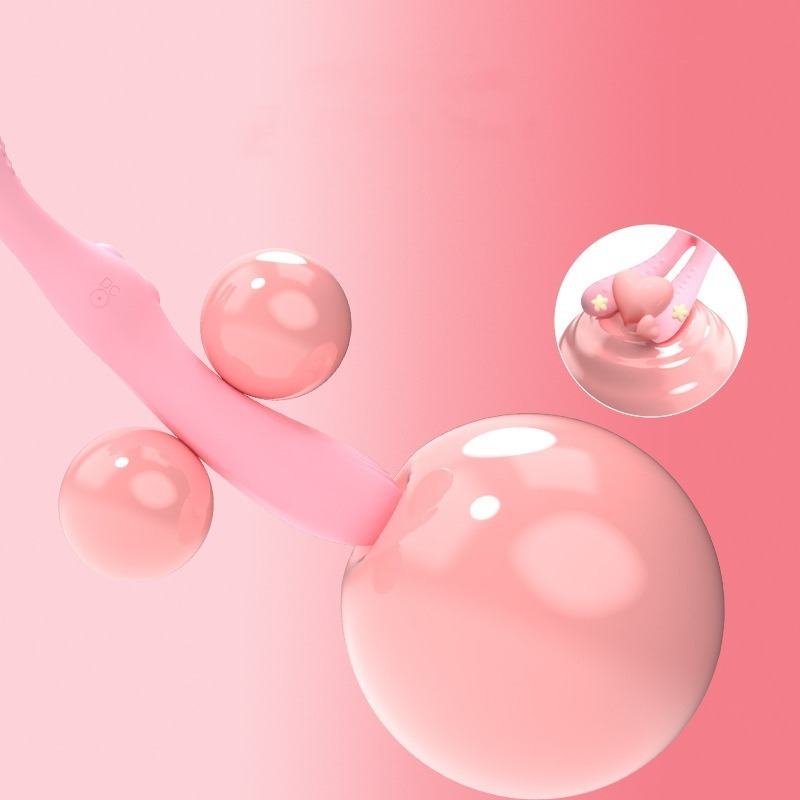 Stylish pink applicator with glossy spheres, perfect for a playful beauty routine.