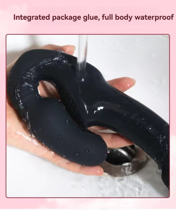 Sleek black silicone waterproof toy held under water, showcasing ergonomic design and functionality.