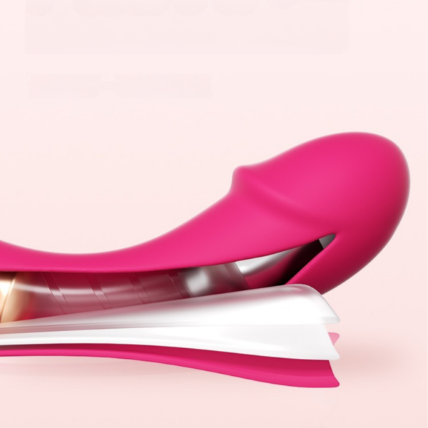 Sleek pink silicone device with ergonomic design and playful features for enhancing intimate pleasure.