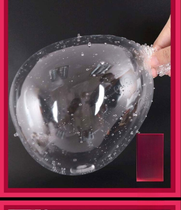 Translucent bubble-like toy held in hand, showcasing unique textures and playful design.