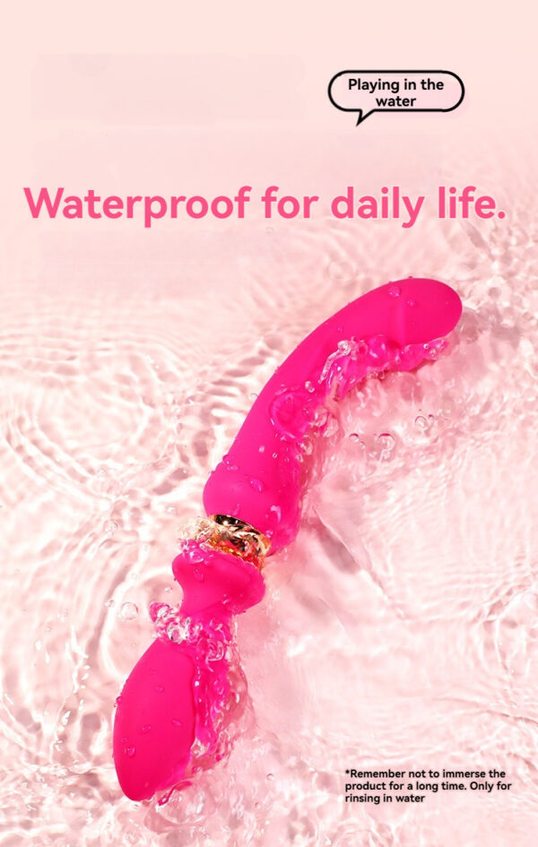 Vibrant pink waterproof vibrator splashing in water, perfect for fun and pleasure.