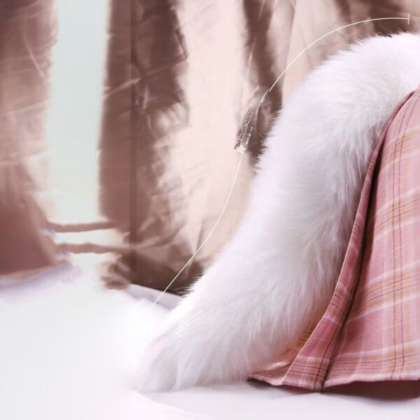 Cozy scene with white faux fur and pink plaid fabric inviting relaxation and warmth.