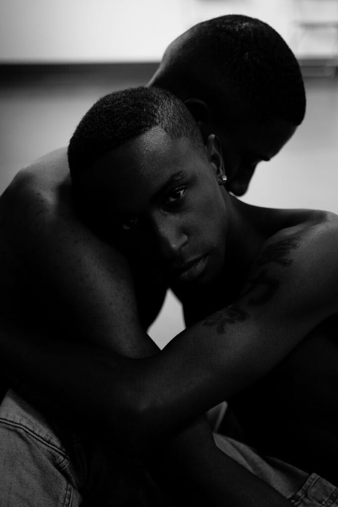 Emotional black and white portrait of a romantic couple embracing indoors.