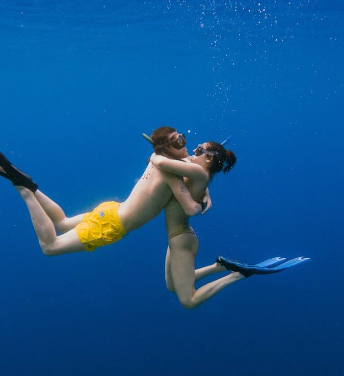 Couple Hugging Underwater