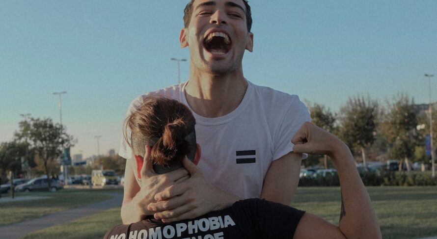 A joyful couple embraces equality and joy in an outdoor setting in İstanbul, Turkey.