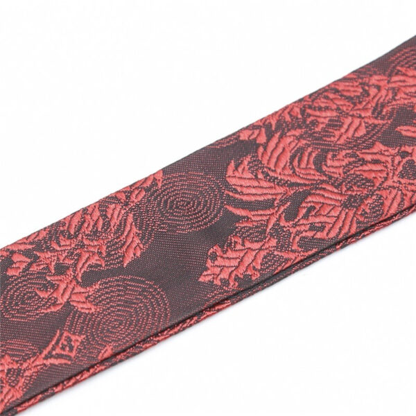 Elegant black floral-pattern necktie with vibrant red design, perfect for formal occasions and accessories.