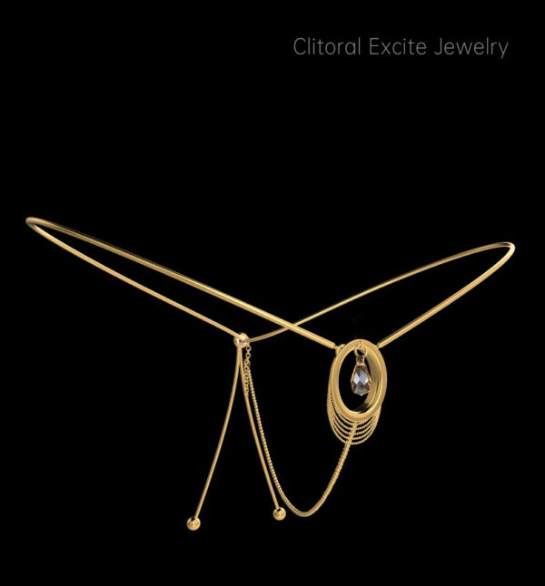 Elegant clitoral jewelry featuring golden design and shimmering gemstone for sensual sophistication.