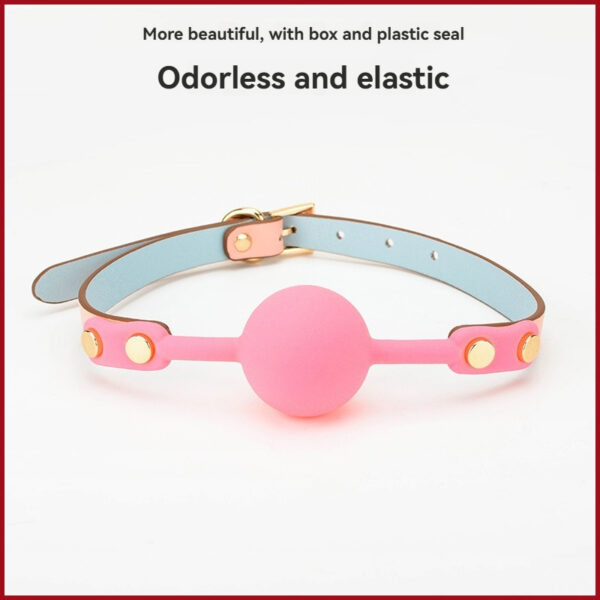 Stylish pink silicone accessory with gold studs, perfect for enhancing intimate experiences and fashion.