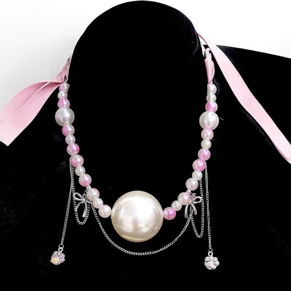 Elegant pearl necklace with vibrant beads and charms, perfect for adding playful sophistication to any outfit.