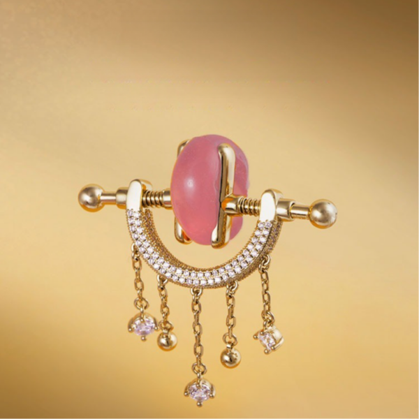 Elegant pink gemstone earrings with gold accents and shimmering details for luxurious accessories.