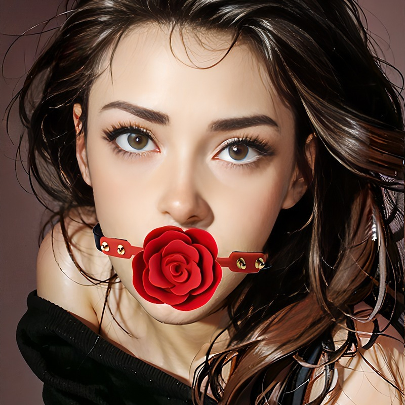 Captivating portrait of a young woman adorned with a unique red rose pacifier accessory.