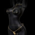 Stylized figure showcasing elegant jewelry, emphasizing curves and forming a captivating artful display.