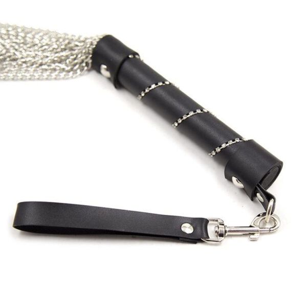 Luxurious whip-style tool with a matte black handle and elegant metallic chains for playful experiences.