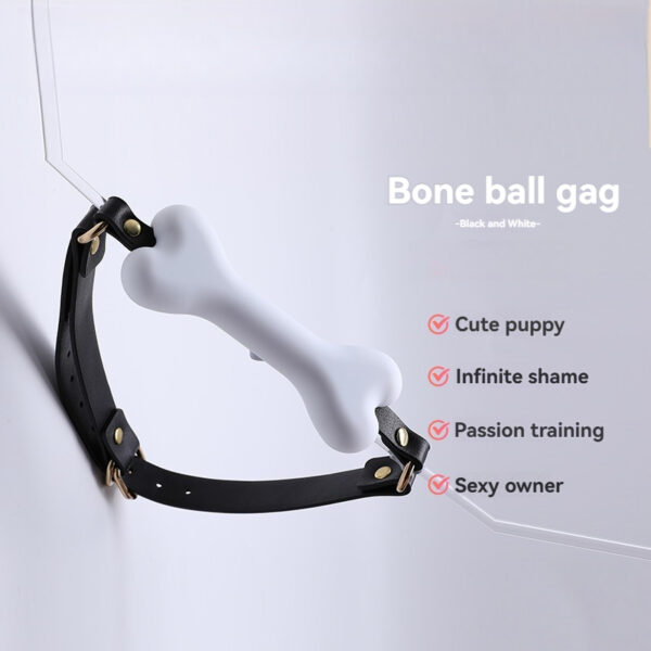 Playful white bone ball gag with black straps for fun adult play accessories.