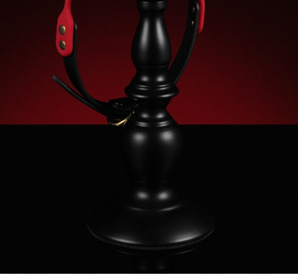 Elegant black hookah with red accents, set against a dramatic red and black background.