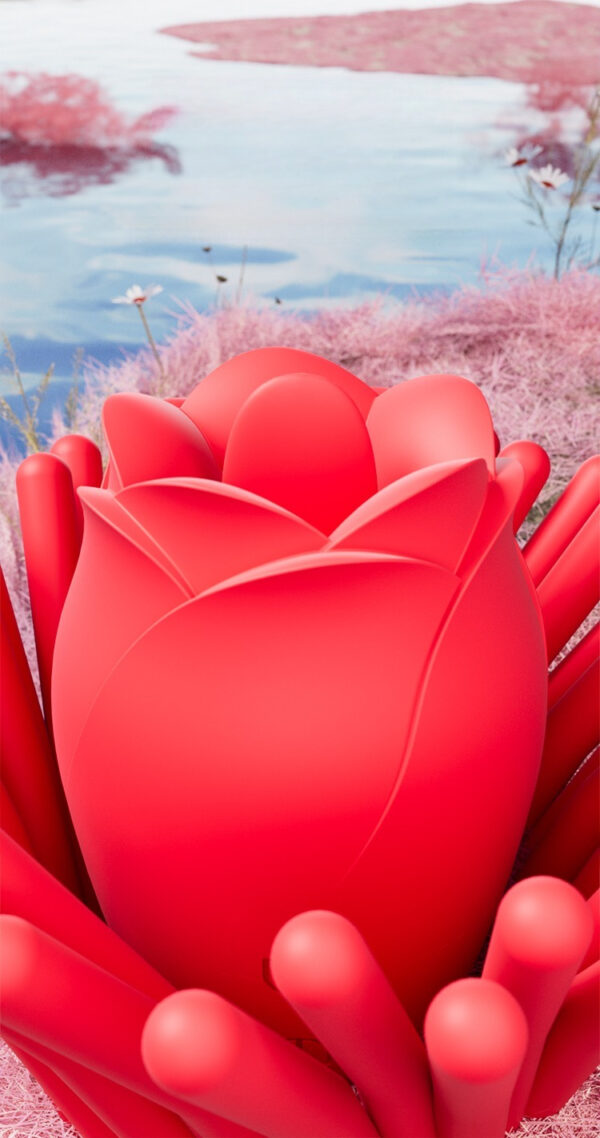 Vibrant red rose with smooth tendrils set against whimsical pastel pink grass and serene water.